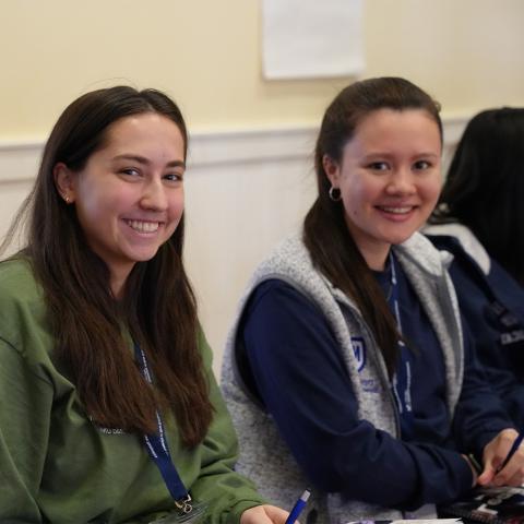 Two students at Lead UNH smiling at camera.